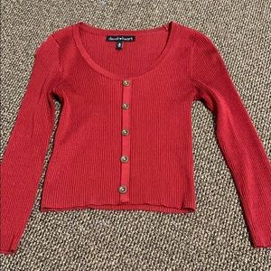 fits a bit longer than a crop top, doesnt unbutton